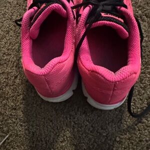 Nike Pink and Black Sneakers with Breathable Mesh and Padded Collar